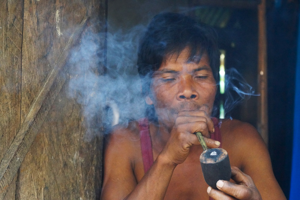 Tirbal man smoking pipe in Northeast India